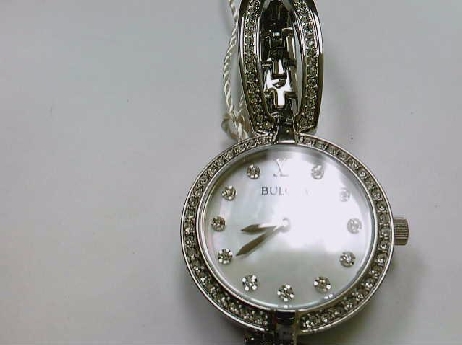 276: Ladies Bulova white crystal Mother of Pearl bangle style bracelet watch