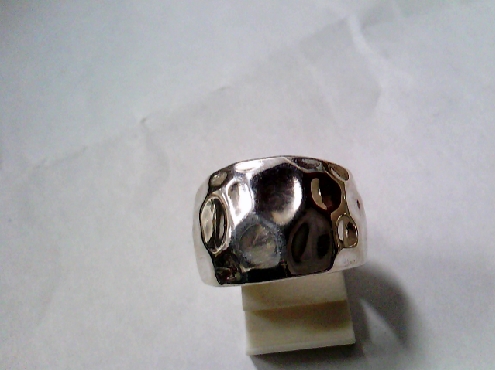 2857: One sterling silver Cigarband ring with a golf ball texture 