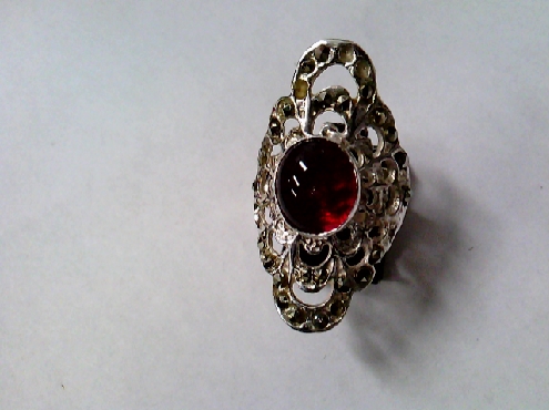 2941: One ladies custom made Inclusion tm Red stone with diamond and marsite stonen ring