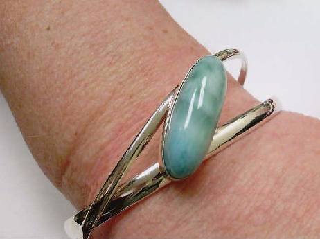 308: One ladies sterling silver double bar bangle cuff set with an oval genuine Larimar stone