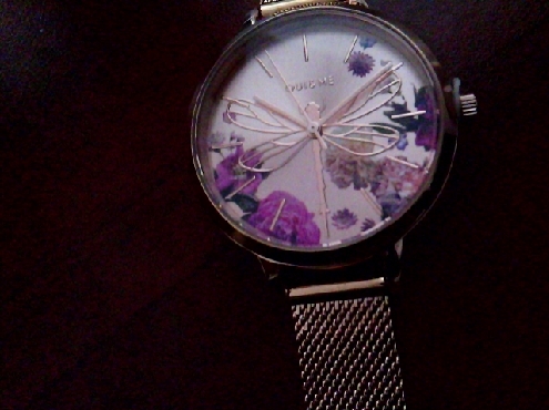 3086: One ladies Oui & Me brand watch of rose gold plated mess watch strap with a Floral motif dial and wire dragonfly