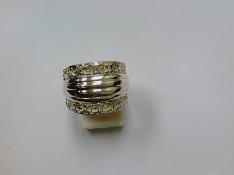 310: one ladies custom made sterling silver band  with scroll work and ribbed middle 