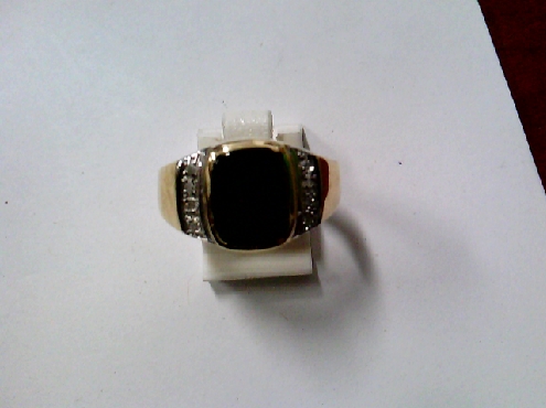 3173: One 10k yellow gold gents ring set with 8 round single cut diamonds and a cushion cut black onyx center stone