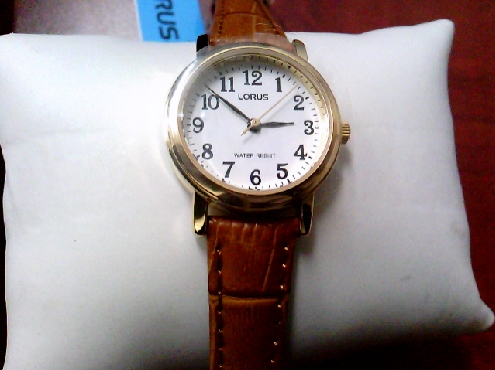 3202: One ladies LORUS ligt brown leather strap round gold face watch