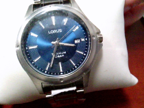 3302: One gentleman s LORUS titanium blue dial buckle watch