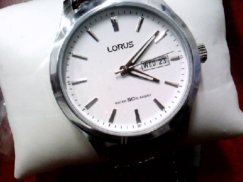 3402: One gentleman s LORUS stainless steel dark brownleather strap watch