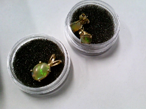 3438: One pair ladies 14ky gold Double Gallery set with genuine opal stud earrings $325 for the set