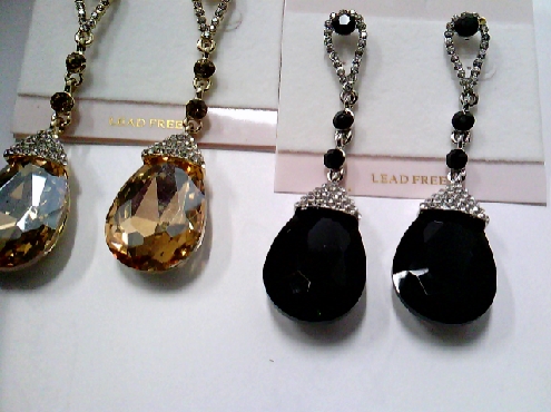 3749: One pair of Monalisa Brand Dangle style earrings with black or topaz tear drop crystal