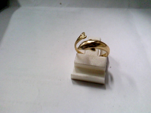 3790: One toe ring of 10k yellow gold of a Dolphin with white ZC stones set into eyes