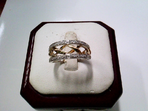 3887: One 10k white and rose gold band set with RBC diamonds and a double ribbon twist middle motif