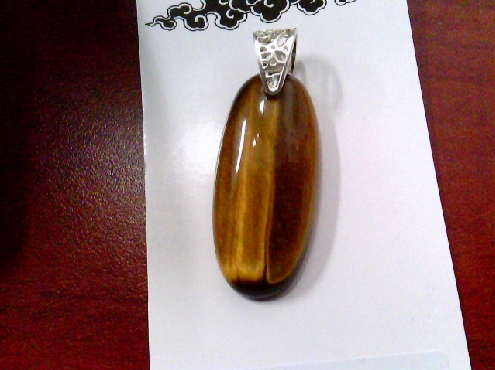 3967: One oval Tiger s Eye pendant on sterling silver