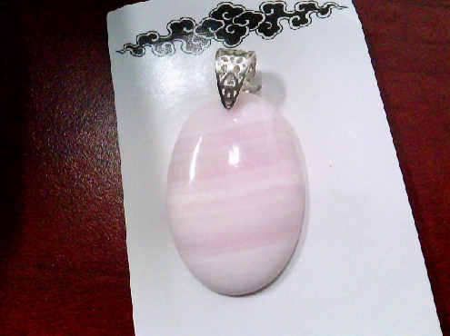 3970: One oval shapped Pink Aragonite pendant on sterling silver