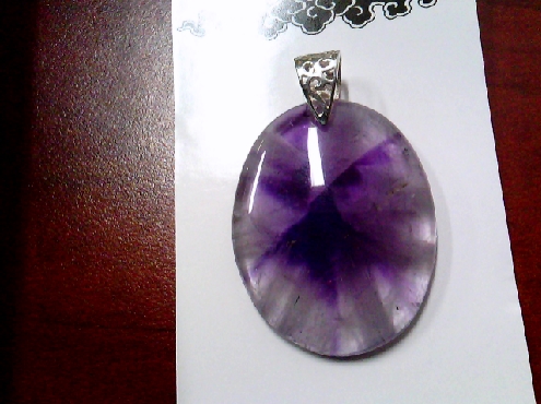 3972: One oval shaped amethyst pendant on sterling silver