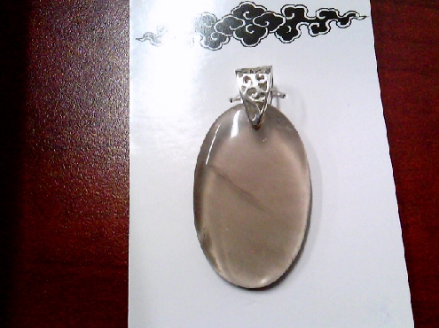 3973: One oval shaped smoky quartz pendant on sterling silver