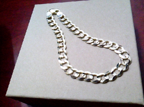 4077: One 8.5 inch comfort curb link getns bracelet of 10k yellow gold 