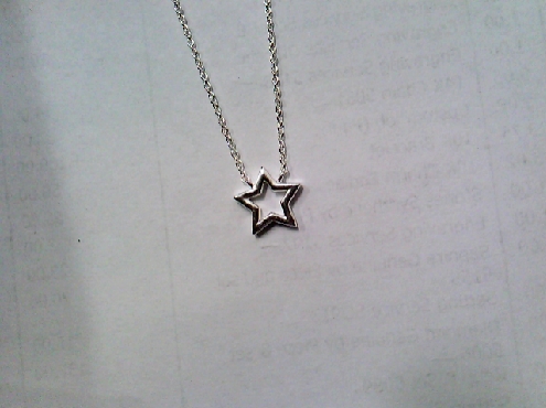 4086: One ladies 925 sterling silver cut-out star necklace 