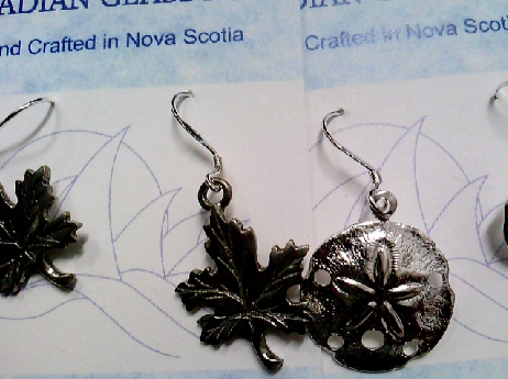 822: Sterling silver fishwire dangle earrings of an Ocean or Maple leaf motif