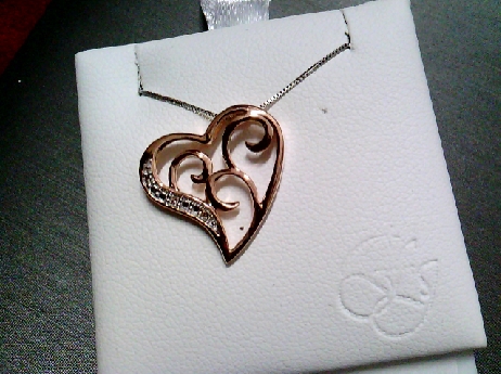 857: Forever Jewellery 10k rose and whit gold  filagree heart pendant set with 2 single cut diamonds of .015 TW box link chain