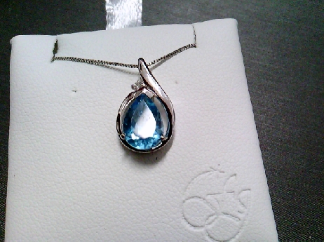 864: Forever Jwellery  10k white gold pear shaped genuine 9x6mmBlue topaz and full cut  diamond 0.15crtw  pendant 