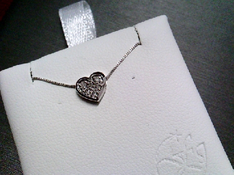 870: Foever Jewellery  10k whtie gold  6 full cut diamonds pave set  into a small Heart pendant on a box lin chain 