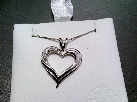 884: Forever Jewellery 10k white gold sculptured Heart pendant set with 4 full cut diamonds 0.04crtw