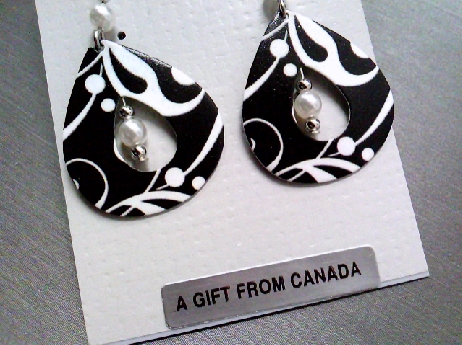 938: Emma & Ivy open tear drop shaped fishwire earrings with a black and white swirl pattern with white bead drops