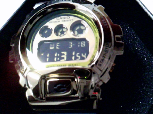 CASIO20: Casio G Shock brand gents watch black resin and gold case and dial