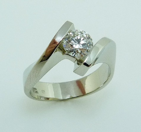 18K White gold ring; set with 0.77 carat G VS2 ideal round brilliant cut diamond by Hearts On Fire; laser inscribed on the girdle HeartsOnFire99951 -