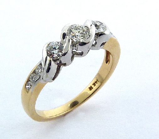 14K yellow and white gold engagement ring; set with an ideal round brilliant cut diamond by Hearts On Fire
-centre: 0.244ct H; SI1 (HOF67295)
-accented with ideal round brilliant cut diamonds by Hearts On Fire; 0.273 carat total weight; SI1-SI2; G