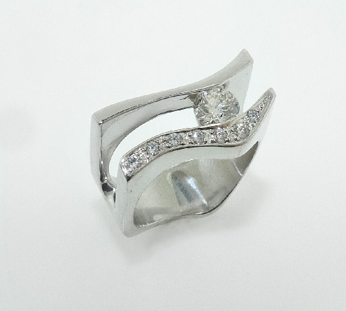14K white gold dinner ring; set with ideal round brilliant cut diamond by Hearts On Fire: - - center: 0.445 G SI1 (HOF101633) - - accented with ideal round brilliant cut diamonds by Hearts On Fire; 0.105 carat total weight G-H SI.
