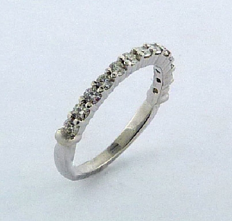 18K white gold Lady s band - Set with ideal round brilliant cut diamonds by Hearts On Fire - Accented with 0.30 carat total weight; G/H SI1-VS2 -