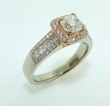 14 karat white and pink gold diamond engagement ring set with:
- 0.68 ct I; VS1 Firecushion brilliant diamond
GIA certificate #6167232862
- 0.47 total carat weight GH; VS/SI diamonds