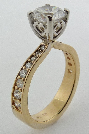 14K Yellow and white gold engagement ring; claw-set with 1 carat CZ . Accented with sixteen F-G SI1-VS2 excellent cut round brilliant cut diamonds; totaling 0.32 carats