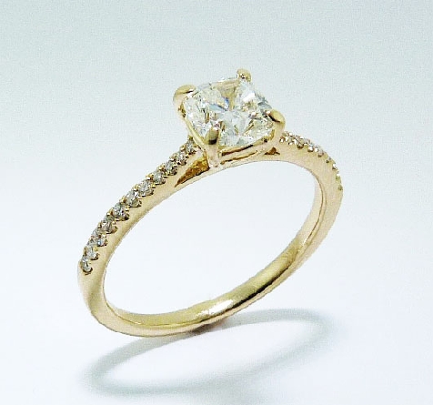 14 karat Yellow Gold Diamond Engagement Ring. Set with:
Center- 00.72 ct I VS1 Fire Cushion Brilliant Cut
GIA# 1166344637
Side-22 diamonds; 0.13 carat total weight; G/H; SI-VS