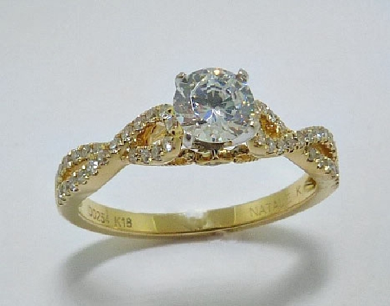 18 karat yellow and white gold engagement ring by Natalie K set with: - - 0.50 ct CZ centre - - 50 round diamonds 0.25 cttw G/H; VS-SI