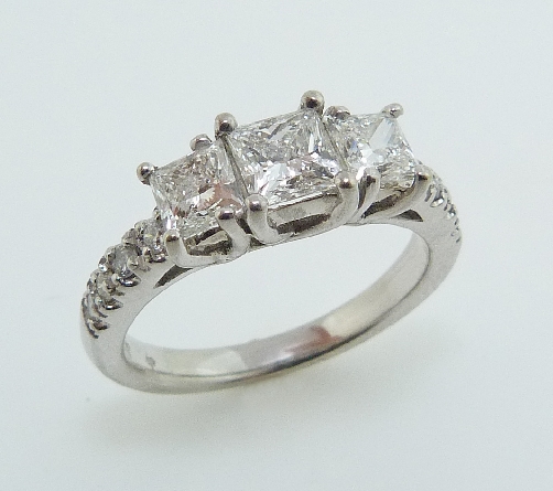 Diamond Engagement Ring
14 K white gold
Set with:
-Firemark diamonds
0.56ct H VS2
0.40ct H VS1
0.40ct H VS2
-8*= 0.167ct GH SI1 good cut round