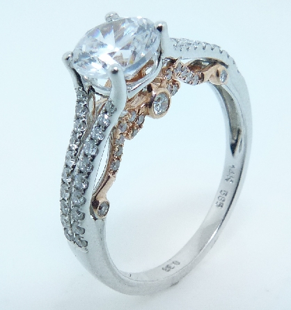 14K white and rose gold engagement ring by Ancora
Set with;
-center: CZ
-accented with round brilliant cut diamonds; 0.38 carat total weight; G/H; VS-SI