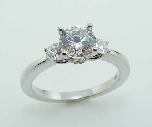14KW diamond engagement ring by Frederic Sage set with:
- 0.75ct CZ
- 2 RBC diamonds; 0.20cttw; G/H; VS-SI
- 10 RBC diamodns; 0.05cttw; G/H; VS-SI