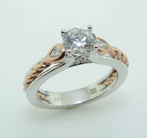 14KWR diamond engagement ring by Frederic Sage set with:
- 0.75ct CZ
- 2 pear shaped diamonds; 0.10cttw; G/H; VS-SI
- 6 RBC diamonds; 0.03cttw; G/H; VS-SI
