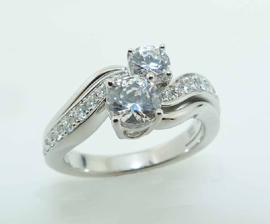 14KW diamond engagement ring by Frederic Sage set with:
- 0.50ct and 0.25ct CZ s
- 2 RBC diamonds; 0.04cttw; G/H; VS-SI
- 20 RBC diamonds; 0.22cttw; G/H; VS-SI