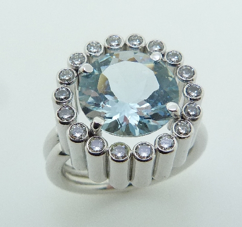 18K white gold custom ring set with:
- 18 ideal round brilliant cut diamonds by Hearts On Fire; 0.64 carat total weight; VS-SI; G/H
- 3.567ct round aquamarine.