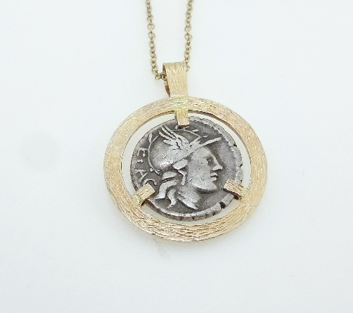 14 KY pendant with barked finish by Studio Tzela set with:
- Denarius (denomination of coin) from the Roman Republic
- Circa 75 BC
- Rutilius Flaccus